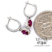 14 karat white gold oval ruby and diamond halo drop earrings, shown with quarter for size reference