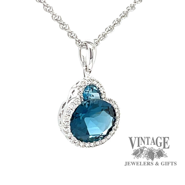 14 karat white gold 2.86 carat total weight Blue Topaz and diamond halo necklace, angled view