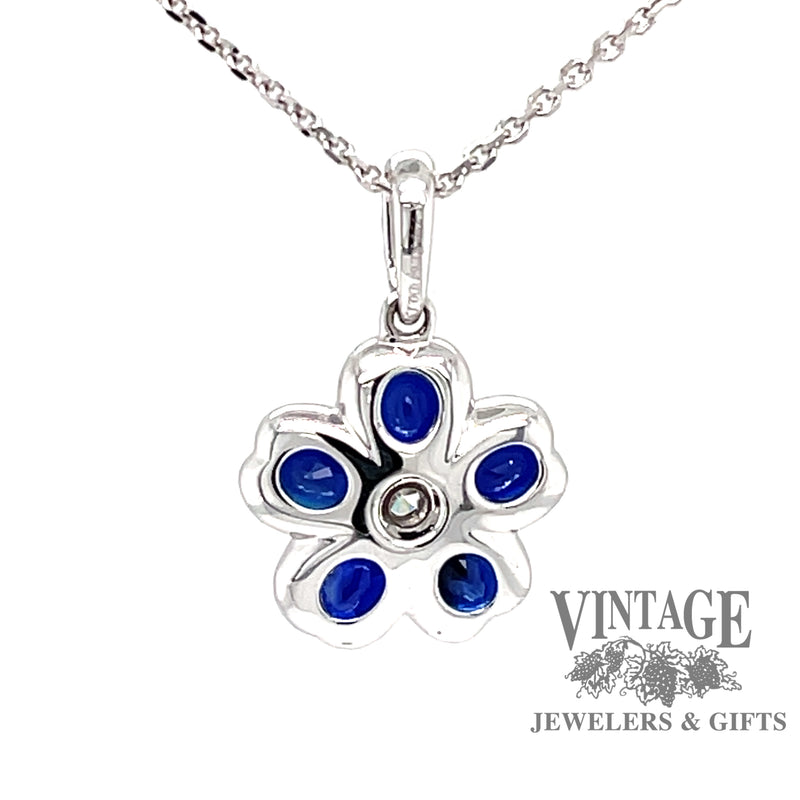 back view 18 karat white gold blue sapphire diamond flower pendant