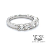 5-diamond 14 karat white gold wedding band, angled view