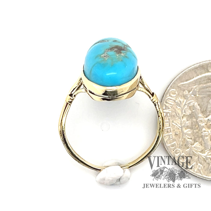 14 karat yellow gold oval turquoise ring with matrix, end view shown with quarter for size reference