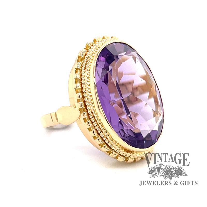 Oval bezel set amethyst 18ky gold ring perspective