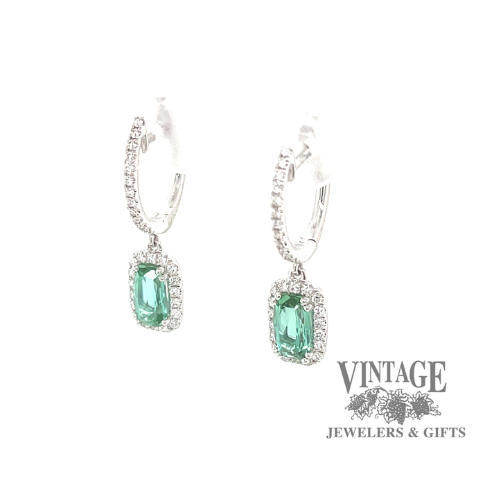 14 karat white gold diamond huggie drop earrings with stunning teal colored tourmalines, angled front view