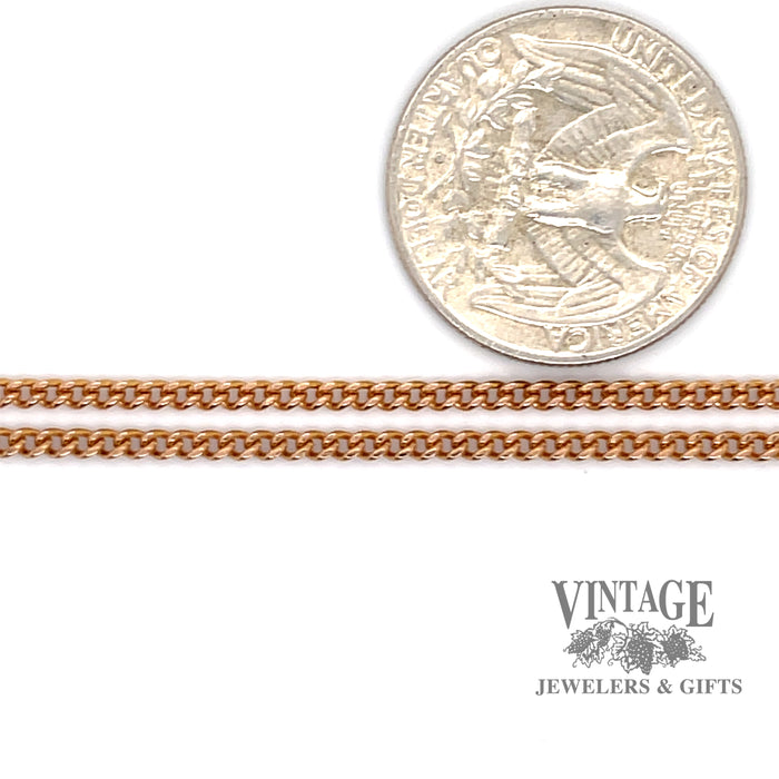 18 karat rose gold curb link chain, shown next to quarter for size reference