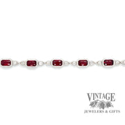 14 karat white gold ruby and diamond link bracelet, unclasped