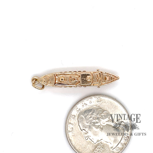 14 karat yellow gold "Spirit of London" 3-D steamship charm, shown from top alongside  a quarter for size reference