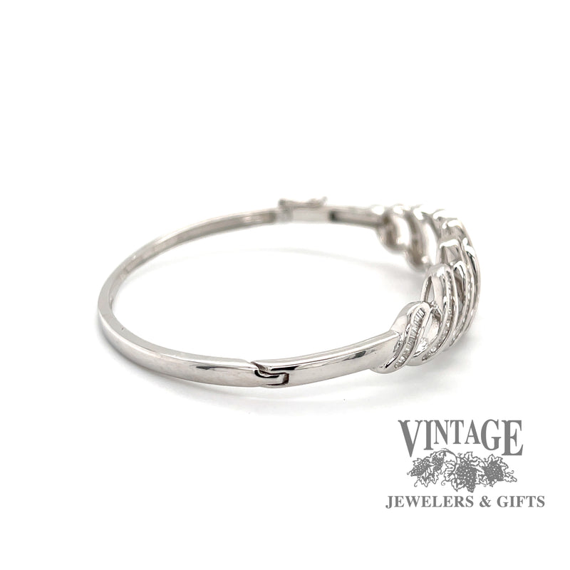 14 karat white gold 3 carat total weight baguette diamond hinged bangle bracelet, side view