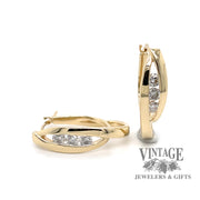 14 karat yellow gold estate diamond hoops with a crossed double oval loop design