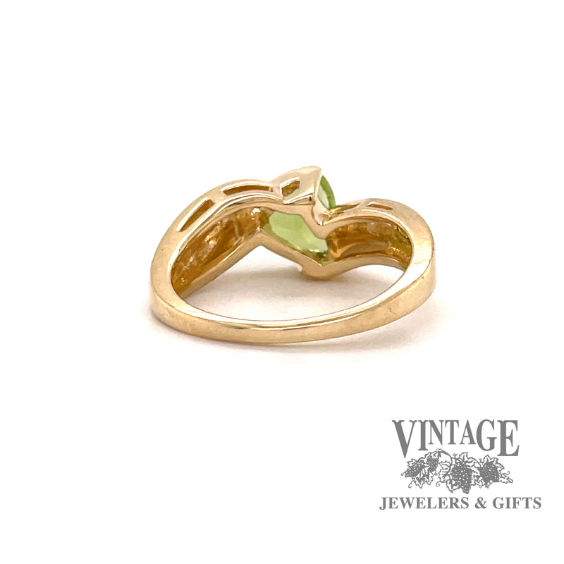 14 karat yellow gold trillion shaped peridot bypass style ring, rear view 