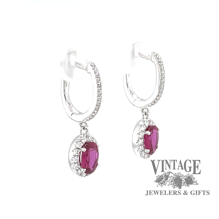 14 karat white gold oval ruby and diamond halo drop earrings, angled view