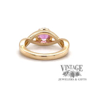Custom 14 karat yellow gold pink sapphire with diamond halo ring, back view