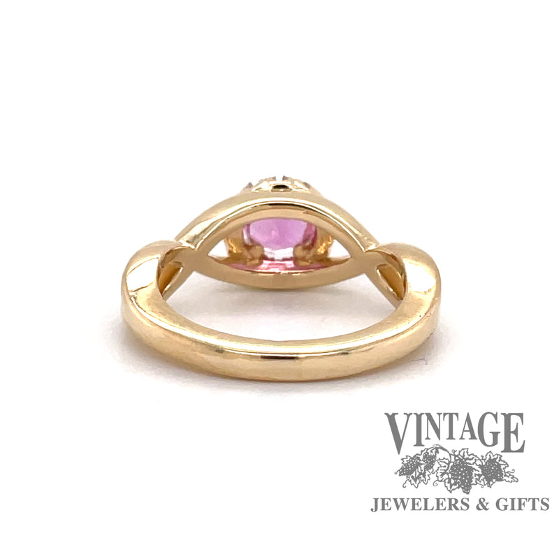 Custom 14 karat yellow gold pink sapphire with diamond halo ring, back view