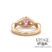 Custom 14 karat yellow gold pink sapphire with diamond halo ring, back view