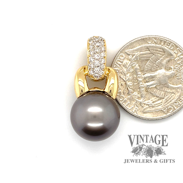 18 karat yellow gold Tahitian pearl enhancer pendant with pave' set diamonds, next to quarter for scale