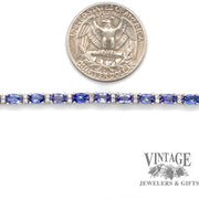 Tanzanite and diamond 18kw gold tennis bracelet quarter for scale