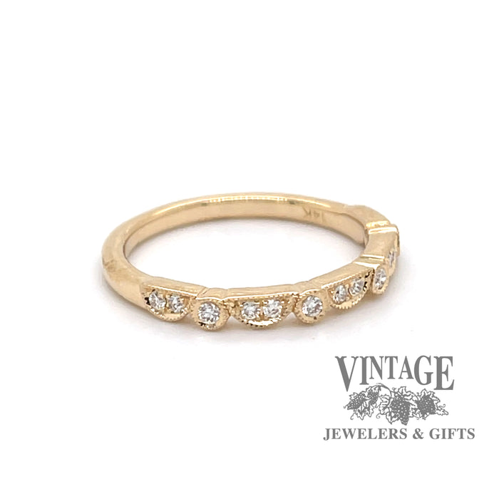 14 karat gold .15 carat total weight diamond wedding band, angled front view/side view.
