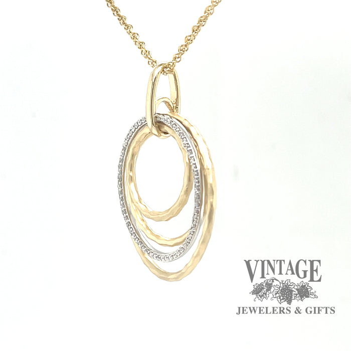 Multi circle 14k two tone gold and diamond pendant, angled perspective
