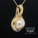 Round Mabe' pearl and diamond 14ky gold pendant angle